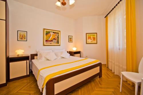 a bedroom with a large bed in a room at Castle Štambuk in Hvar