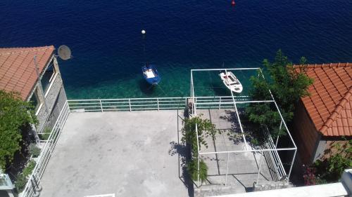 an aerial view of two boats in the water at Apartments Šojka in Sobra