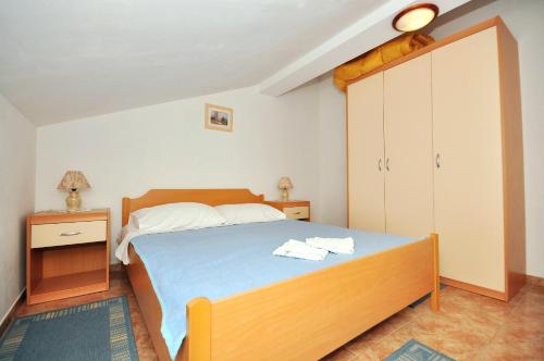 Ένα ή περισσότερα κρεβάτια σε δωμάτιο στο Apartments Andelo
