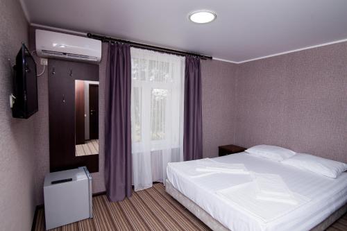 Кровать или кровати в номере Hotel Capri