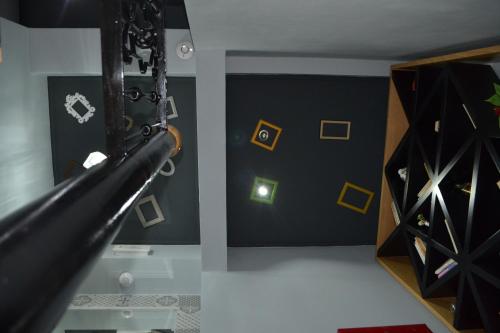a room with a slide and a wine rack at Funky Guest House & Adventures in Përmet