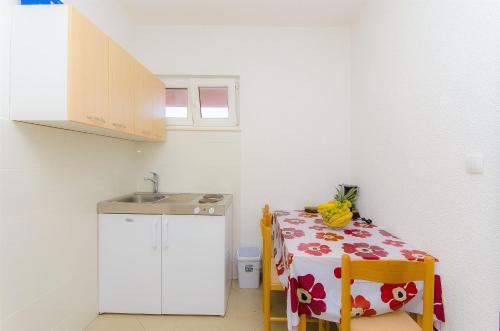 Postel nebo postele na pokoji v ubytování Apartments Tiho i Pave