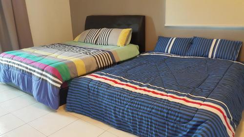 Ένα ή περισσότερα κρεβάτια σε δωμάτιο στο Woon Homestay