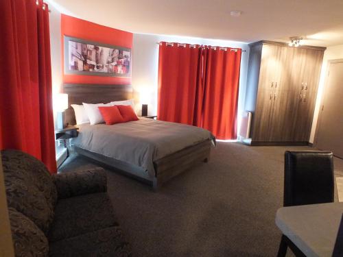 Postel nebo postele na pokoji v ubytování Hotel & Suites Monte-Cristo