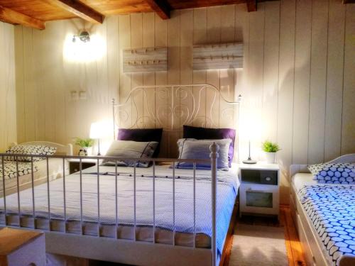 a bedroom with two beds in a room at Holiday House Little Precious in Sveti Anton