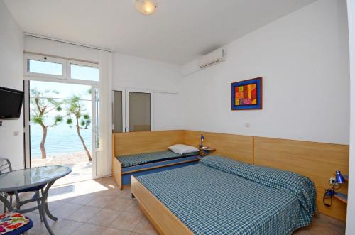 Postel nebo postele na pokoji v ubytování Apartments Jure