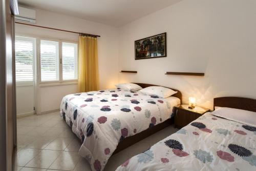 Postel nebo postele na pokoji v ubytování Apartment Mery
