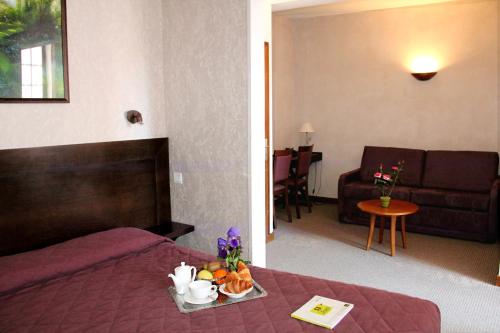 Posezení v ubytování Logis Des Trois Maures