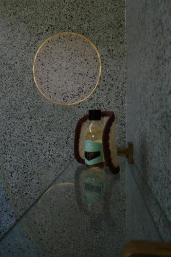 a glass table with a hanger on the floor at El Romeron Casa de Campo in San Francisco