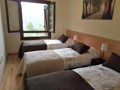 Postel nebo postele na pokoji v ubytování Apartamentos Argualas