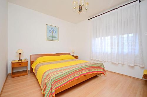 En eller flere senger på et rom på Apartments Mirela