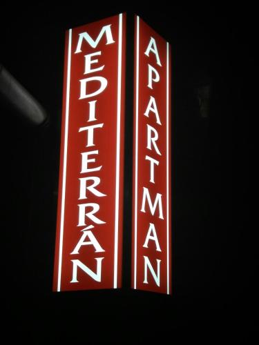a red and white sign with the word theatre at Mediterrán Vendégház in Nagyatád