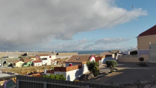 a view of a town with houses on a hill at Alojamento S. Pedro in Peniche