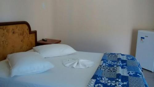 Ένα ή περισσότερα κρεβάτια σε δωμάτιο στο Pousada 4 Estações