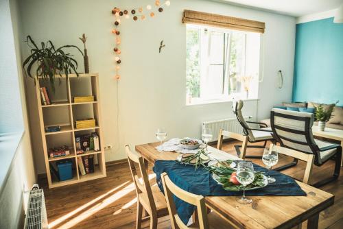 a dining room with a table and chairs at Krauklis beach apartments in Saulkrasti