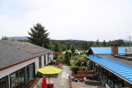 an overhead view of a building with a yellow umbrella at Timberlodge RV & Campground in Port Alberni