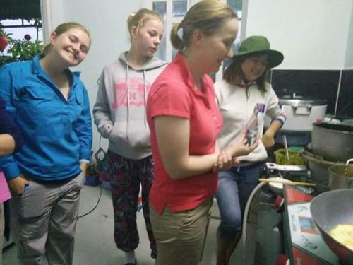 a group of women standing in a kitchen at Tuan Thanh Homestay in Tân Hiệp