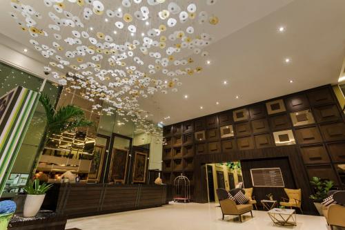 a large lobby with a ceiling with a chandelier at Verdant Hill Hotel Kuala Lumpur in Kuala Lumpur