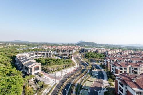 an aerial view of a city with buildings at Somerset Jeju Shinhwa World in Seogwipo