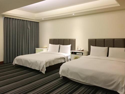 Krevet ili kreveti u jedinici u objektu Zaw Jung Business Hotel