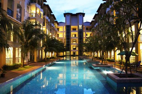 a swimming pool in the middle of a building at Tiara Desaru Seaview Residence in Desaru