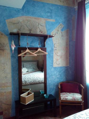 a bedroom with a bunk bed with blue walls at L'Azzurro e il Blu' in Vietri sul Mare