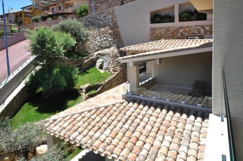 an aerial view of a house with a roof at Domu Simius Life Style Hotel in Villasimius