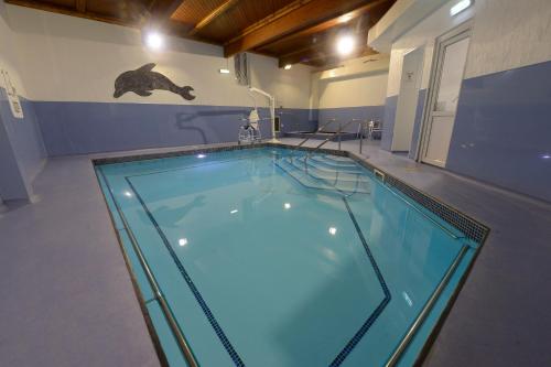 a large swimming pool in a room with a swimming pool at Royal Maritime Hotel in Portsmouth