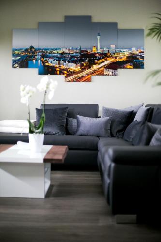 a living room with a couch and a view of a city at Am Schmeding in Berlin