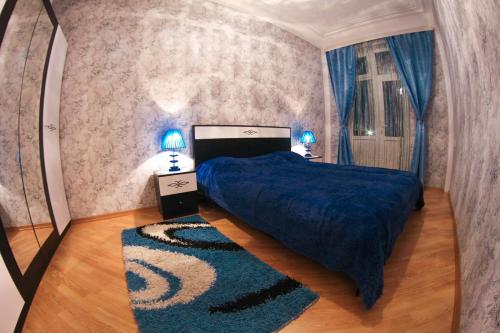 Ένα ή περισσότερα κρεβάτια σε δωμάτιο στο OLIMP Apartment