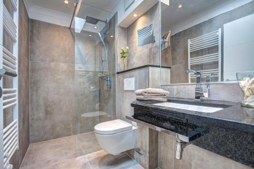 Phòng tắm tại Aparthotel Villa Lea