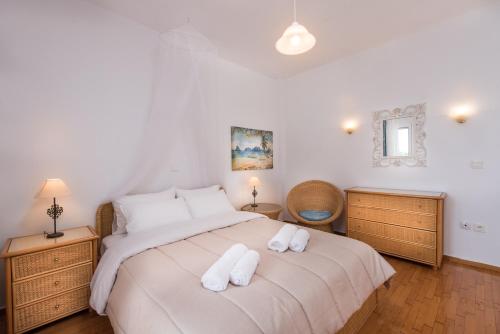Ένα ή περισσότερα κρεβάτια σε δωμάτιο στο Exotic Palm Villa
