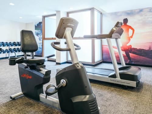 a gym with two tread machines and a treadmill at Travelodge Pattaya in Pattaya Central