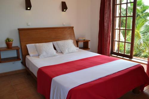 Postel nebo postele na pokoji v ubytování Guest House Orquidea