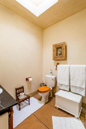 a bathroom with a toilet and a sink at Villa Pescatori in Yzerfontein