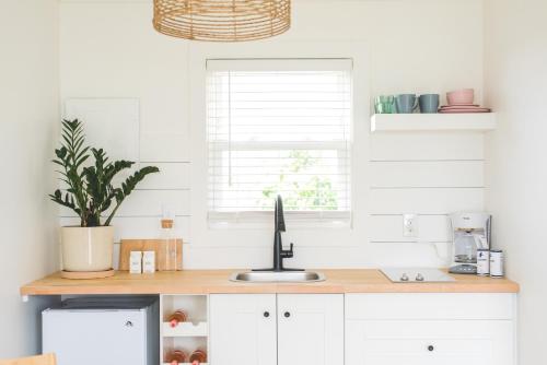 a kitchen with a counter with a computer on it at Breakers Montauk in Montauk