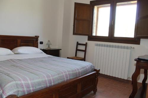Postel nebo postele na pokoji v ubytování Hotel Il Feudo Dei Pierleoni