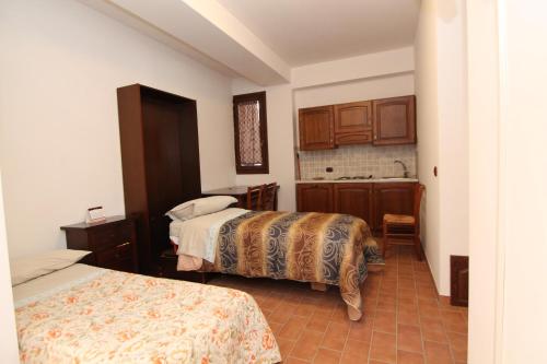 Postel nebo postele na pokoji v ubytování Hotel Il Feudo Dei Pierleoni