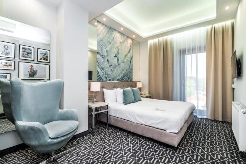 Posteľ alebo postele v izbe v ubytovaní Hotel Atelia