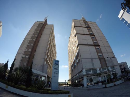 two tall buildings next to each other at ibis budget Tambore in Barueri