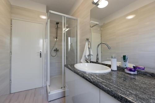 a bathroom with a sink and a shower at Villa Sarah in Supetar