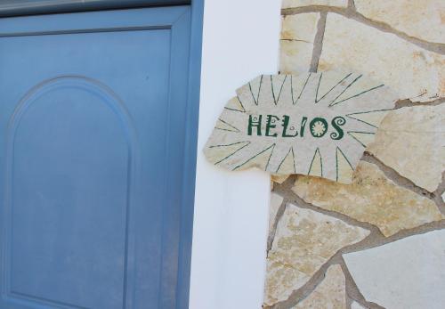 a cross with the word heles on a wall at Fairway Villas, A Terra Lusso Property in Gialova