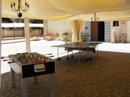 a table with a chessboard on it under a tent at Hotel Villa San Donino in Città di Castello