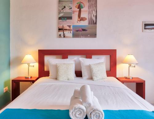 Ein Bett oder Betten in einem Zimmer der Unterkunft The Ritz Village Hotel