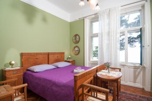 Postel nebo postele na pokoji v ubytování Apartmani Belsito