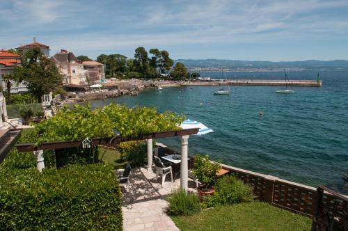 a view of a body of water with a pier at Apartmani Belsito in Lovran