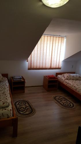 Postel nebo postele na pokoji v ubytování Casa Borcean