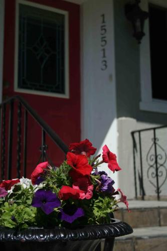 a pot of flowers sitting on top of a porch at Semi Centre House in White Rock