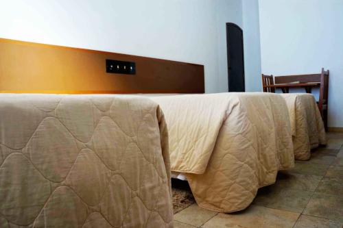 a bed in a room with at Hotel Zibamba in São Francisco do Sul