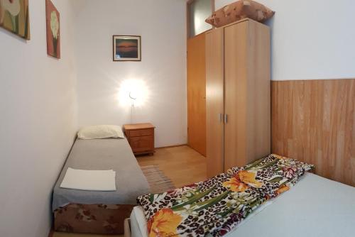 Postel nebo postele na pokoji v ubytování Apartments Brčić